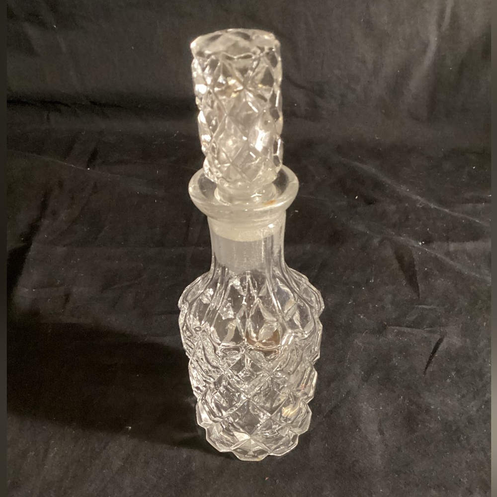 Clear, brilliant cut glass cruet with ground glass stopper 3” x 7”